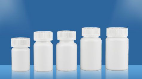 What are the commonly used materials for tablet bottles