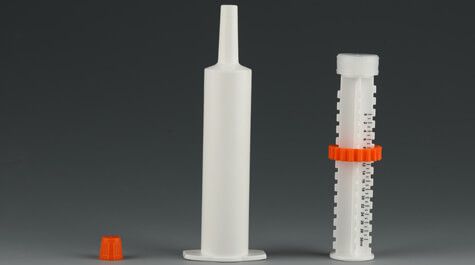 Dose syringe barrel with cap